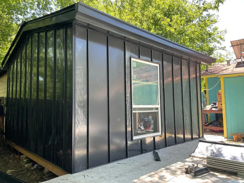 Black standing seam metal wall panels for Roof Inspection in Orange